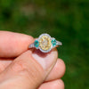 Once Upon A Diamond Engagement Ring White & Yellow Gold Natural Fancy Yellow Oval Diamond Ring with Emerald Accents 18K