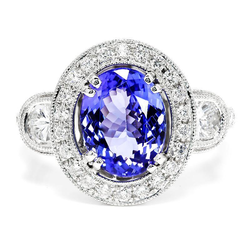 Once Upon A Diamond Ring Oval Tanzanite Halo Ring with Half Moon Diamond’s 18K